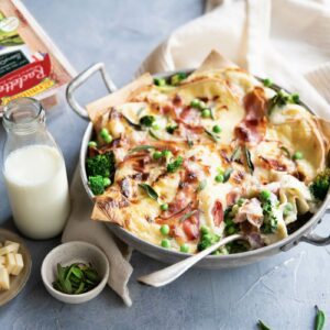 Lasagne with raclette, broccoli, peas and pancetta