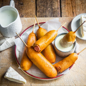 Corn dog with Tartiflette cheese sauce